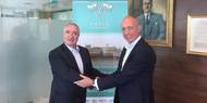 Alasdair Evitt, Group Director, Ship Management East, V.Group shakes hands with Hugh Williams, Chief Executive Officer, Graig Shipping Plc following announcement to employees in Cardiff and Shanghai (Photo: V.Group)