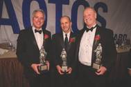 Matt Cox, Anthony Chiarello and Jim McKenna with their USS AOTOS statues.