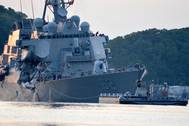 The Arleigh Burke-class guided-missile destroyer USS Fitzgerald (DDG 62) returns to Fleet Activities (FLEACT) Yokosuka following a collision with a merchant vessel while operating southwest of Yokosuka, Japan. (U.S. Navy photo by Peter Burghart)