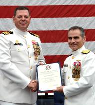Rear Adm. Brian Brown, commander, Naval Meteorology and Oceanography Command, (right) presents Capt. Van Gurley with a certificate of retirement commemorating 26 years of naval service during a ceremony held July 12 at Stennis Space Center, Miss. (U.S. Navy photo by Jenni Ervin)