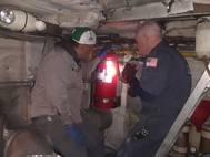 Coast Guard Chief Warrant Officer John Bafia inspects a New York Waterway vessel with the help of a crew member November 23, 2019. The Coast Guard inspected all of New York Waterway's operational ferries in less than two weeks. (Photo by Petty Officer 3rd Class John Hightowe; Courtesy photo by U.S. Coast Guard)