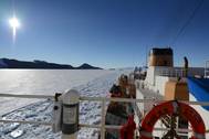 U.S. Coast Guard Cutter Polar Star, a heavy icebreaker homeported in Seattle, Washington, rests in the ice as the motor vessel Ocean Giant departs from the National Science Foundation’s McMurdo Station, Feb. 1, 2017. One of the primary responsibilities of the Polar Star’s crew is to provide an escort for the Ocean Giant through the frozen Ross Sea off of Antarctica. (U.S. Coast Guard photo by Chief Petty Officer David Mosley)