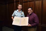 Commander Jason Smith, USCG presents the United States Coast Guard Meritorious Public Service Award to Roy Bleiberg, Vice President of Engineering for ABS Americas Division. Photo ABS