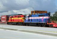 Crowley containers aboard the FEC Train during the recent opening ceremony of the new intermodal container transfer facility adjacent to Crowley's Port Evergaldes terminal. (Photo courtesy of Crowley)