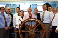 L-R, Art Mead of Crowley. John Ara of Crowley, Eric McAllister of McAllister, Margaret Kaigh Doyle of MRA, Brian McAllister of McAllister, David Usher of MPC, Dan Schwall of Titan, Buckley McAllister of McAllister, and Scott Powell of MHR. (Photo courtesy MRA)