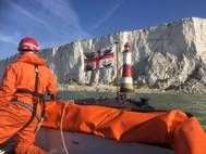 The UK Department of Transport is to order new vessel for Trinity House to replace the THV Patricia and provide safety information and guidance for ships in UK waters and abroad.
A Trinity House workboat approaching Beachy Head Lighthouse on the south coast of England. Trinity House’s fleet of support vessels carries out a number of activities around England, Wales and the Channel Islands in support of its role as a General Lighthouse Authority.
(Photo: Trinity House)
