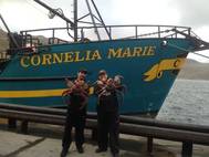 Josh Harris (left) and Casey McManus (right), with fishing boat Cornelia Marie