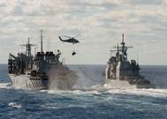 File Image: U.S. Navy warships underway and engaged in underway replenishment. CREDIT: U.S. Navy