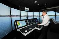 Capt. John Kessler, maritime instructor, demonstrates how mariners train using the bridge simulators at the San Jacinto College maritime program. Photo credit: Jeannie Peng-Armao, San Jacinto College