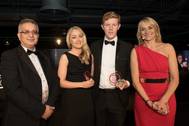 Lauren Kemp, second left, collects her Rising Star award from Prof Ahmed Al-Shamma’a of Liverpool John Moores University, left, the award sponsor. Pictured here with joint Rising Star winner John-James Gallagher of Royal HaskoningDHV and event host BBC Breakfast presenter Louise Minchin. (Photo: Mersey Maritime)