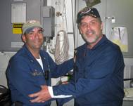 Maersk-Alabama Capt. Richard Phillips, right, stands alongside Cmdr. Frank Castellano, commanding officer of USS Bainbridge after being rescued by U.S Naval Forces off the coast of Somalia. (Official U.S. Navy photo)