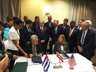 Manuel Fernandez Perez Guerra, Director General of the National Port Administration of Cuba, and Brandy Christian, Port of New Orleans Chief Operating Officer, sign a memorandum of understanding in Havana Oct. 4. Louisiana Gov. John Bel Edwards (standing directly behind Christian) and Michael Kearney, Chairman of the Port of New Orleans Board of Commissioners (standing front right), were among the 50-member Louisiana trade delegation that visited Cuba Oct. 3-7. Photo NOLA