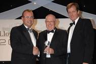 Maurice Storey, Honorary Chairman, Evergreen Marine (UK) accepts the Corporate Social Responsibility Award from Captain Henrik Kristensen, head of CSR at APM Terminals (left) and Alastair Campbell (right) .