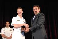 Northrop Grumman Corporation presented the 2014 Elmer A. Sperry Junior Navigator of the Year Award to Midshipman Robert Francisco Yerkes-Medina in ceremonies at the U.S. Naval Academy. The award was presented by Jeff Holloway (right), director of the company's Charlottesville, Virginia, campus and an academy graduate. (Photo courtesy of Northrop Grumman)