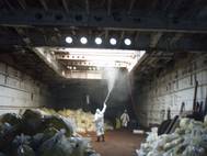 File photo: Workers clean the interior of a cargo hold aboard the LST-1166. (U.S. Coast Guard photo/Pacific Strike Team)