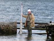 A photograph by Philip Woodworth showing David Pugh doing what he enjoyed most – making temporary sea level measurements – in this case in the Falkland Islands in 2009. Photo courtesy NOC