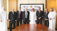 Qatargas CEO Khalid bin Khalifa Al Thani (fifth left), United Arab Shipping Company CEO Jorn Hinge (fourth left), and Managing Director and Chairman of Qatar Shell Companies, Michiel Kool (sixth left) along with other officials after the signing ceremony. Photo: Qatargas
