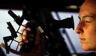Quartermaster 2nd Class Stephanie Hudson from Plymouth, Mass., peers through a marine sextant, a navigational instrument used to determine celestial navigation aboard USS Ronald Reagan (CVN 76). Reagan is underway in the Pacific Ocean conducting Tailored Ship's Training Availability (TSTA). U.S. Navy photo by Photographer's Mate 3rd Class Kevin S. O'Brien (U.S. Navy)