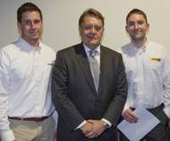 left to right: Sam Reid, Finning Power Systems, John Hayes, John Hayes, Minister of State for Further Education, Skills and Lifelong Learning and Richard Buzza, Finning Power Systems.