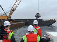 Left to right: MD Secretary of Transportation Gregory Slater, MD Governor Larry Hogan, and MPA-Port of Baltimore Executive Director William Doyle observe dredging operations at Seagirt Marine Terminal for a new 50-ft. berth in March 2021. (Photo: Maryland Port Administration)