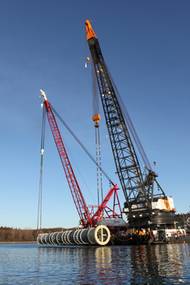 Salvage of a 485-ton, 140-foot long stainless steel reactor vessel that rolled off a barge.