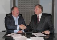Shane J. Guidry, Chairman & CEO, Harvey Gulf (left) and J. Barry Snyder, President, Signet Maritime sign closing documents on May 15 at Harvey Gulf International Marine in New Orleans, Louisiana for the sale of Harvey’s Offshore Towing Division to Signet Maritime.