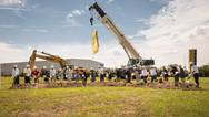 With shovels in hand, Sophie Albrecht, Jan Liebherr, Liebherr USA, Co. Managing Directors, its building partners and government officials broke ground during the ceremony. (Image: Liebherr)