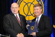 SNAME President Peter Noble presents ACMA President Scott McClure with his SNAME Fellow’s Certificate
