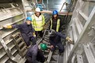 Stewart Graves, managing director, and Rita Beard, safety officer, observing work being carried out by Benjamin Cardew, Paul Hethrington and Richard Davey on the 20m BMT Nigel Gee design wind farm support vessel (Photo courtesy of Mustang Marine)