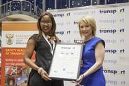 Sylvia Siyo, Acting Ship Repair Manager in the Port of Durban (left), receiving the Best Head of Department in Transport award from Catherine Larkin, Executive Director of the Chartered Institute of Logistics and Transport. Photo TNPA