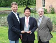 Dr Tatsuo Nishikawa (middle) is presented with the DNV GL Compit Award 2015 by Albrecht Grell (left), Director of the Maritime Advisory Division at DNV GL - Maritime, and COMPIT organiser Volker Bertram (right), DNV GL - Ma