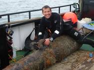 Vincent Woolsgrove with one of the Dutch cannons (Photo: Maritime and Coastguard Agency)