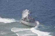 Waves Break Over USS Guardian: Photo credit USN