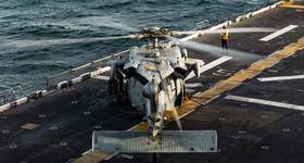 An MH-60 Sea Hawk helicopter lands on the forward-deployed amphibious assault ship, USS Tripoli (LHA-7) in the U.S. Central Command area of responsibility, June 11, 2026. (U.S. Marine Corps Photo by Cpl. Maksim Masloboev)