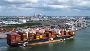 With downtown Tampa as its backdrop, the ZIM Canada arrives carrying 11,900 twenty-foot equivalent units (TEUs) — the highest capacity ever handled at Port Tampa Bay. © Port Tampa Bay