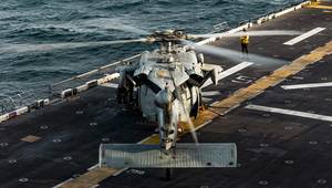 An MH-60 Sea Hawk helicopter lands on the forward-deployed amphibious assault ship, USS Tripoli (LHA-7) in the U.S. Central Command area of responsibility, June 11, 2026. (U.S. Marine Corps Photo by Cpl. Maksim Masloboev)