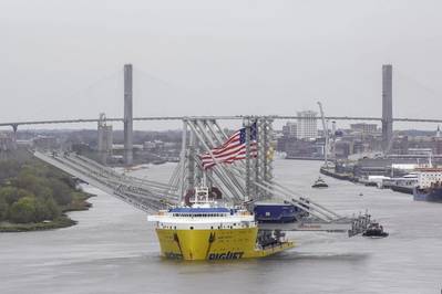The cargo ship BigLift Barentsz sails past historic River Street to the Port of Savannah with three new Neo-Panamax ship-to-shore cranes on Tuesday, March 10, 2020. When fully assembled, the cranes will stand 295 tall, with booms reaching 22 containers across. (Photo: Georgia Ports Authority / Stephen B. Morton)