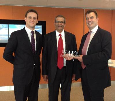 David Phillips (middle), Chairman of the NAFL and CEO of Freight Systems LLC presents Julien Horn (left) and Andrew Kemp (right) from TT Club with an award in recognition of their expertise.