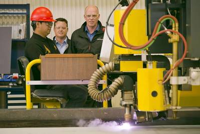 (left to right) Vancouver Shipyard’s Chester Saret - Burning Area Chargehand, Brian Carter – President, Seaspan Shipyards, and Mike Corrigan – President & CEO, BC Ferries, oversee the first cut of steel on the new BCFS Cable Ferry.