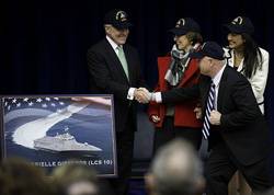 The Secretary of the Navy (SECNAV) the honorable Ray Mabus shakes hands with retired Navy Capt. Mark Kelly, husband of former U.S. Rep. Gabrielle Giffords, from Arizona, at the Pentagon. Mabus announced that the name of the 10th littoral combat ship, LCS 10, will be USS Gabrielle Giffords. (U.S. Navy photo by Chief Mass Communication Specialist Sam Shavers/Released)