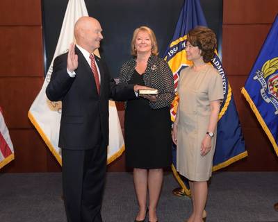 U.S Secretary of Transportation Secretary Elaine L. Chao administers the Oath of Office to Rear Adm. Mark H. Buzby, USN, Ret. as Maritime Administrator (L to R: Admiral Mark H. Buzby, Gina Buzby and Secretary Elaine L. Chao) (Photo: MARAD)