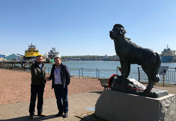 Agency Manager David Thorburn (left) with the Harbourmaster of Montrose Port Authority, Tom Hutchison and local legend Bamse the St Bernard. (Photo: GAC Group)