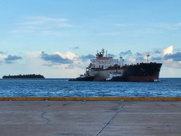 Tugs attend an MR product tanker in the deep-water Port of Guam (Photo: Inchcape)