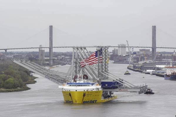 The cargo ship BigLift Barentsz sails past historic River Street to the Port of Savannah with three new Neo-Panamax ship-to-shore cranes on Tuesday, March 10, 2020. When fully assembled, the cranes will stand 295 tall, with booms reaching 22 containers across. (Photo: Georgia Ports Authority / Stephen B. Morton)