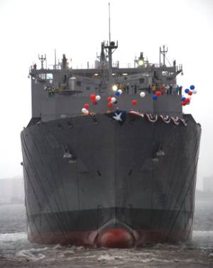 USNS Charles Drew, the 10th ship in the Navy's class of dry cargo/ammunition ships, slides into the water following its christening Feb. 27, at the General Dynamics NASSCO shipyard in San Diego. (Photo courtesy U.S. Navy)