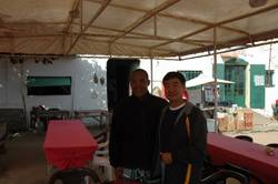 Chinese Evacuees arrive in Greece and Victor Mooney with Chen Shun of XINHUA News Agency on Goree Island, Senegal.
