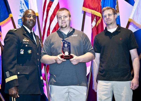 Army Brig. Gen. Darrell K. Williams (left) presents award to Wing representatives Dave Ackroyd and Aaron Powell.