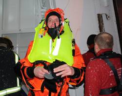 Gudmunder Bragason of Sónar emerges from Rejkavik harbour covered in ice after the successful Kru lifejacket/ R10 demonstration.
