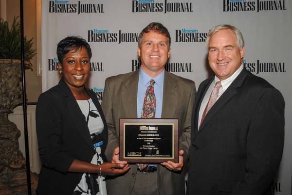 Ed Hagar (center) accepted the Mississippi Business Journal's Healthiest Workplace Award on behalf of Ingalls Shipbuilding. Hagar, Ingalls’ manager of compensation, benefits and HRIS, is pictured with Tami Jones, associate publisher of the Mississippi Business Journal, and Murray Harber, executive director of the Mississippi Business Group on Health. (Photo: Bill Glenn/HII)