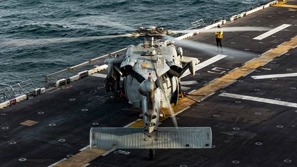An MH-60 Sea Hawk helicopter lands on the forward-deployed amphibious assault ship, USS Tripoli (LHA-7) in the U.S. Central Command area of responsibility, June 11, 2026. (U.S. Marine Corps Photo by Cpl. Maksim Masloboev)